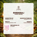 Bhringraj hair mask packaging with brand details on a natural background