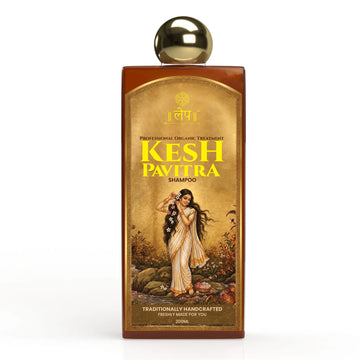 Kesh Pavitra shampoo bottle with gold cap on a white background an elegant traditional indian woman with long flowing black hair posing gracefully, featuring the kesh pavitra ayurvedic shampoo product label in gold and brown tones with a vintage aesthetic.