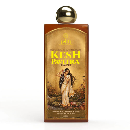 Kesh Pavitra shampoo bottle with gold cap on a white background an elegant traditional indian woman with long flowing black hair posing gracefully, featuring the kesh pavitra ayurvedic shampoo product label in gold and brown tones with a vintage aesthetic.